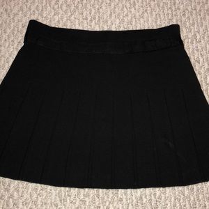 Black shirt pleated skirt